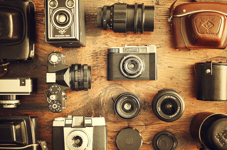 Retro Cameras and Lenses on the Wooden Table, Flat Lay photo