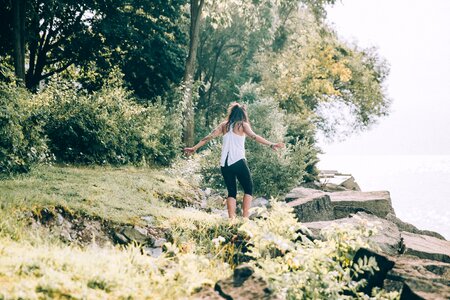 Woman Walks Down To Waters Edge photo