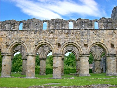 Indoor view of old roofless abandoned cathedral in San Galgano