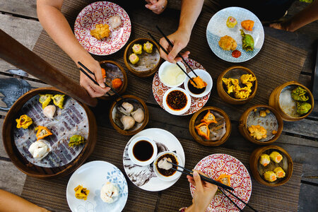 Vibrant shot of feasting on Chinese steamed and fried dim sum photo