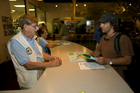 Volunteers assist refuge visitors photo