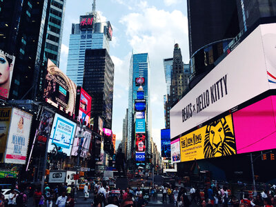 People, buildings, and busy life in Times Square in New York City photo