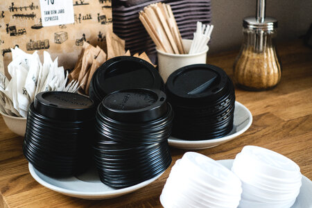 Black paper cup lids for takeaway coffee photo
