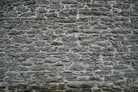 Picture of a really old and weathered stone wall. photo