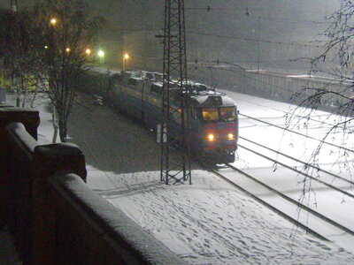 Train at railroad crossing in winter
