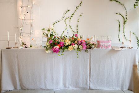 Bride and Groom Table Decorated with Flowers