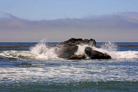 Clouds ocean rocks