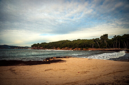 Seaside and beach landscape under the sky and clouds photo