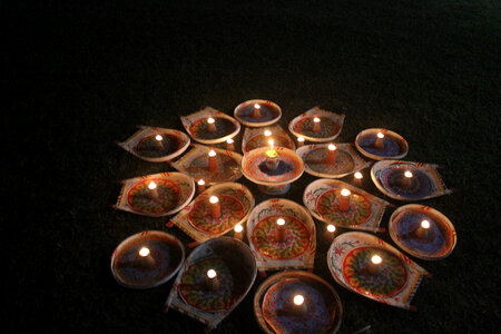 Burning candles in Buddhist temple photo