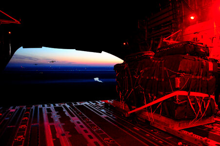 A small bundle is dropped from a C-17 Globemaster II