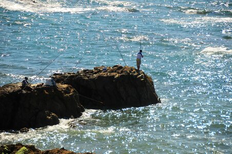 Fisherman sea rocks