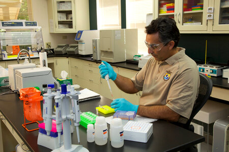 Service scientist conducts ELISA tests-2