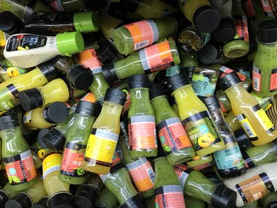 Bottles and jars with sauce and salad dressing in a supermarket