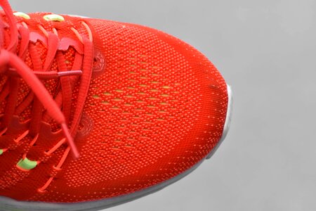 Reddish shoelace sneakers
