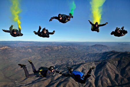 Skydivers parachutists jump out of an airplane photo