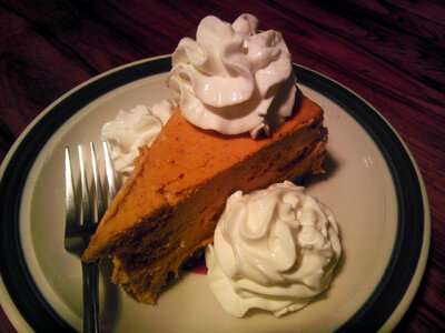 Pumpkin Pie with Whipped Cream on top photo