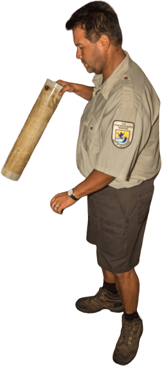 FWS Employee Cleaning Fish Raceway
