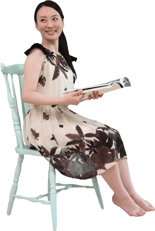 Asian Woman Sitting with Magazine