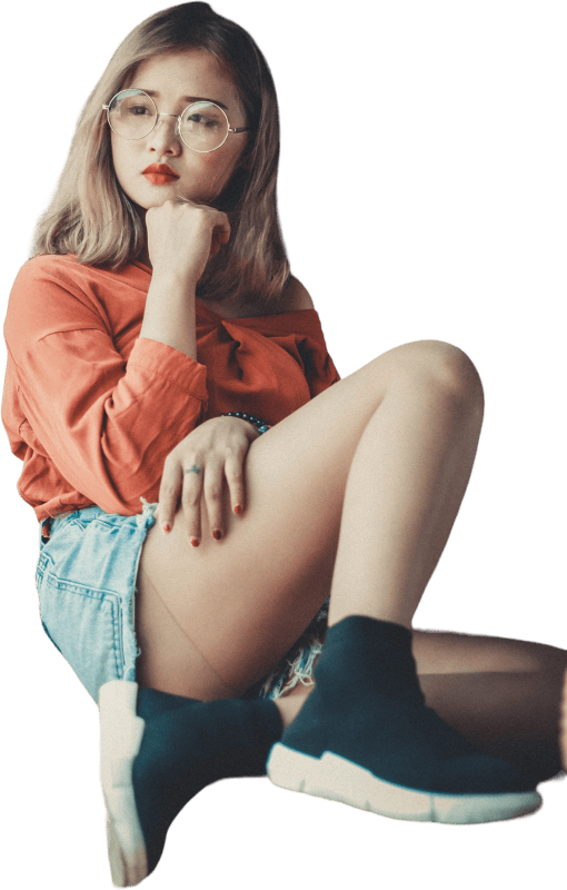 Woman in Orange Top and Denim Shorts