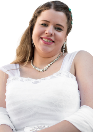 The bride smiles in her dress