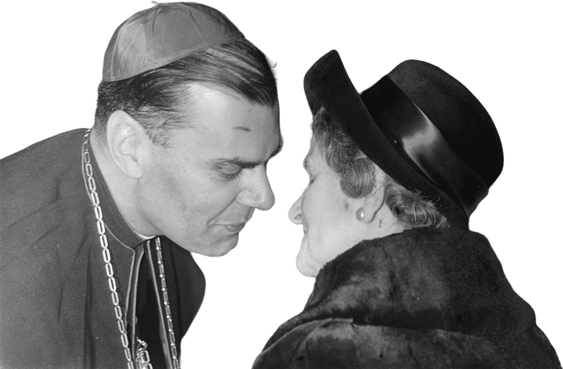 Woman Greeting Clergyman