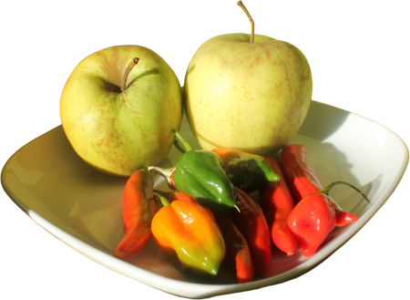 Apples and Hot Peppers on Plate