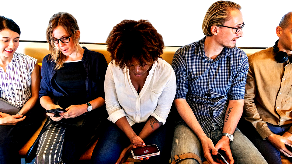 Group of diverse people riding a train