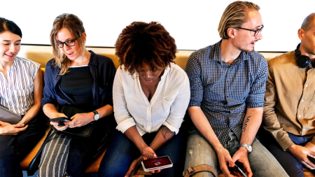 Group of diverse people riding a train