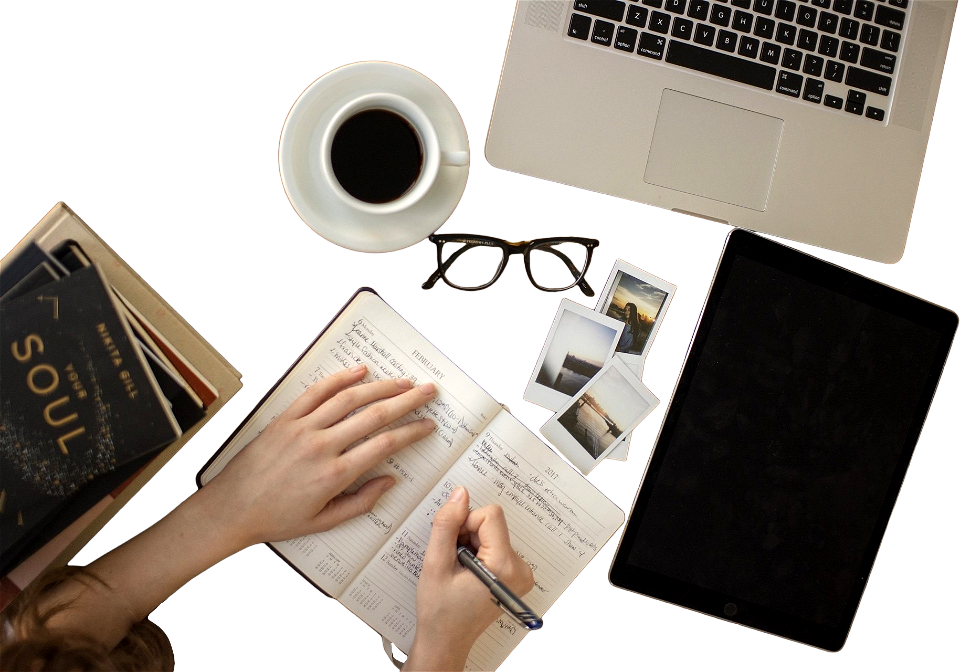 Top View of Hand Writing on a Notebook with Laptop Tablet and Hot Coffee