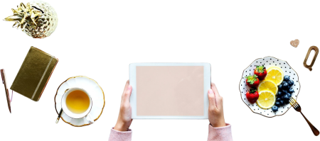 Hands with tablet computer during breakfast