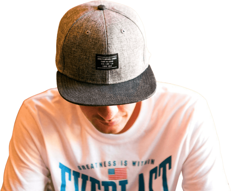 Man in White Crew Neck T Shirt Sitting