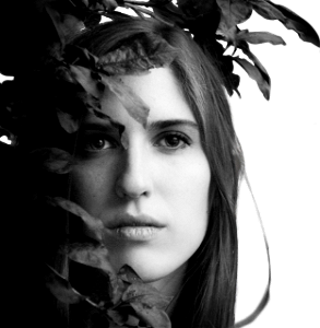 Black and White Portrait of a Beautiful Young Woman Hidden in The