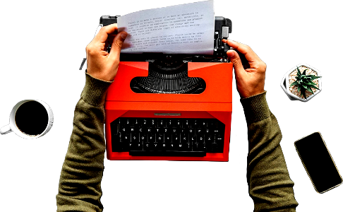 Hands pulling paper from a typewriter
