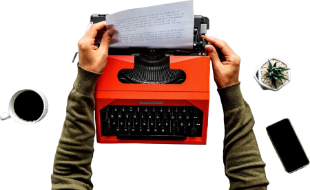 Hands pulling paper from a typewriter