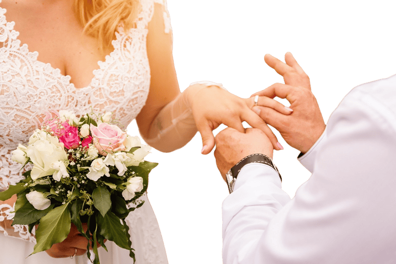 Close up groom put the wedding ring on bride romantic atmosphere