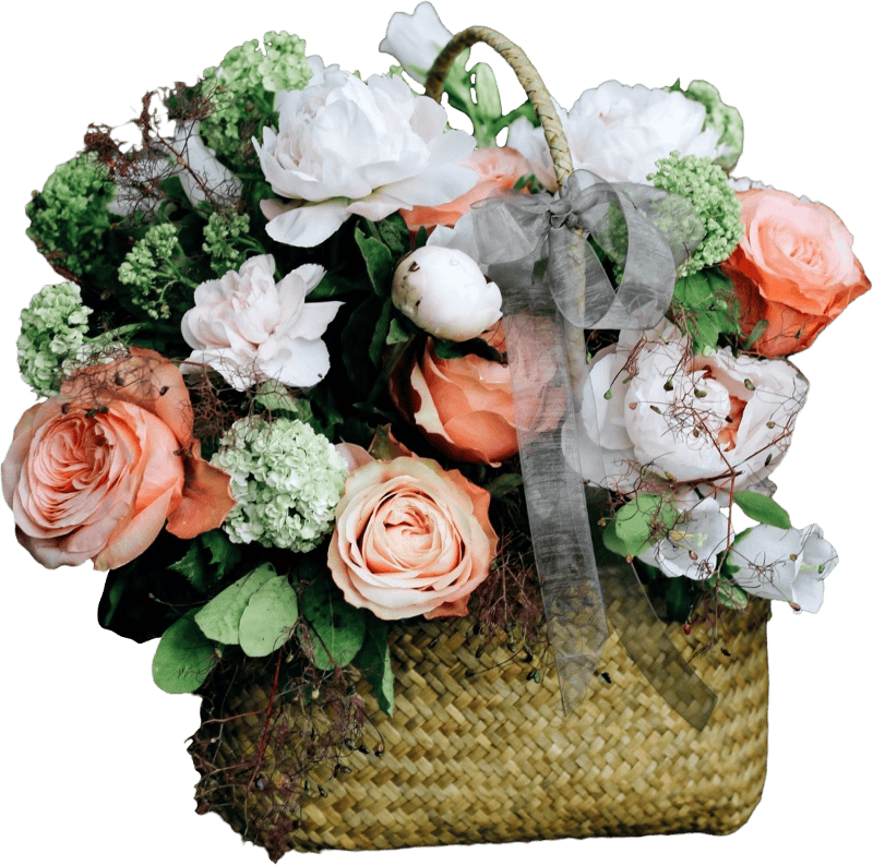 Bouquet of white and pink flowers in basket