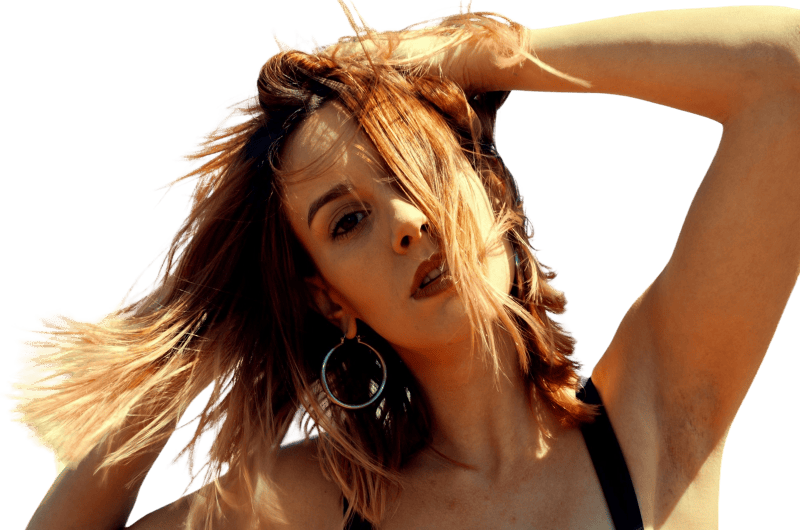 Close up photography of a woman touching her hair