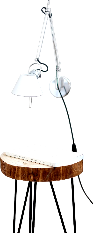 Gray desk lamp mount on white wall under brown stool with white book on top near