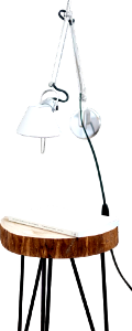 Gray desk lamp mount on white wall under brown stool with white book on top near