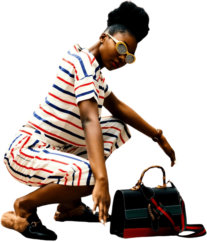 Woman wearing white sunglasses and stripe shirt sitting
