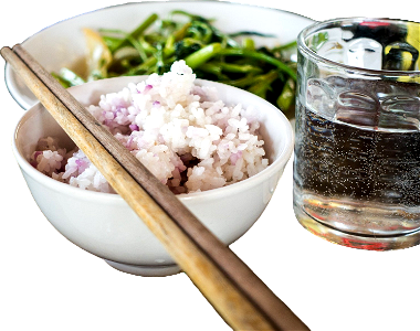 Rice in a bowl with chopsticks