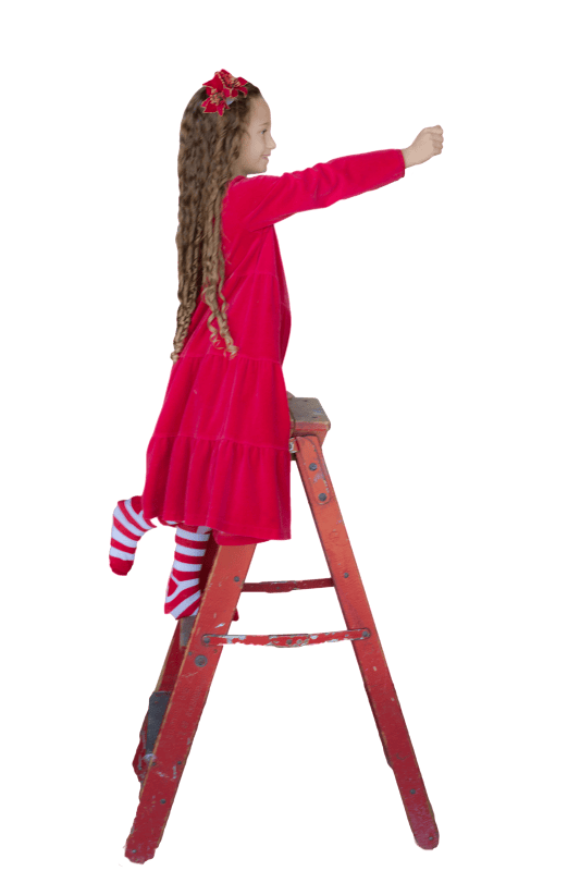 Little girl red ladder decorating