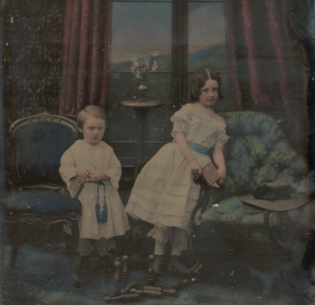 [Stereograph, Two Children Standing Between Furniture in a Studio Parlor Setting], circa 1855