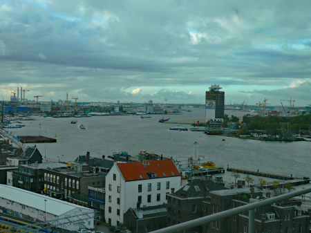 (Amsterdam photo, 2006) - a view over the curving river IJ, seen from Oosterdokseiland. On the right side the North border of the river IJ with the Shell tower then. City photography in The Netherlands by Fons Heijnsbroek