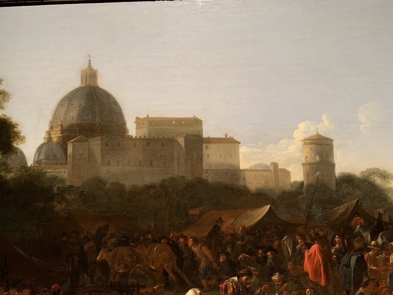 Market scene in Prati outside Rome with the dome of Saint Peter's in the background, on the left side of the foreground carnival-goers, Jan Miel, circa 1650