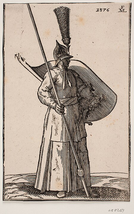 Soldier standing, facing h.; on the head a pointed helmet with considerable plume; in h. hand a lance whose apex is outside the upper framing line; on v. arm a shield with the inside facing upwards, Melchior Lorck, 1576