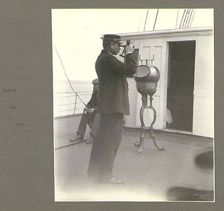 Captain Peter Doran using a sextant to take measurements aboard the steamer GEORGE W. ELDER, Alaska, July 1899., Taken on 1 July 1899