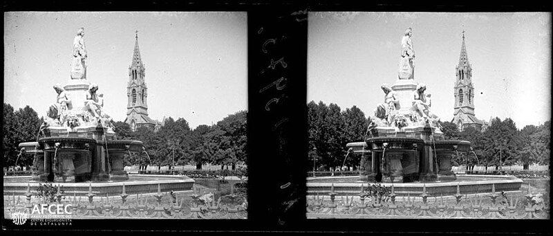 The fountain Pradier of Nimes and in the background the bell tower of the church of Sainte-Perpétue and Sainte-Félicité of Nimes, ca. 1913