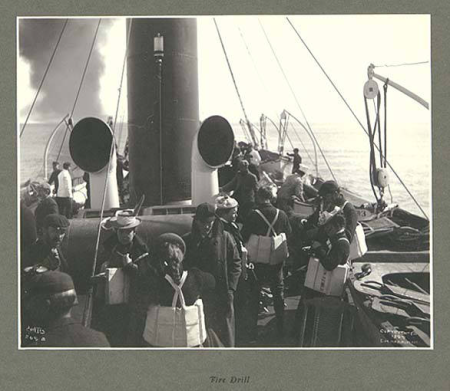 Members of the expedition taking part in a lifeboat drill aboard the GEORGE W. ELDER, June 1899., Taken on 1 June 1899