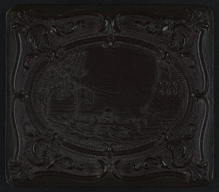 Union case for daguerreotype, ambrotype, or tintype showing monitor-class ship next to fort (front) and scroll motif (back) LCCN2010648993, between 1852 and 1866